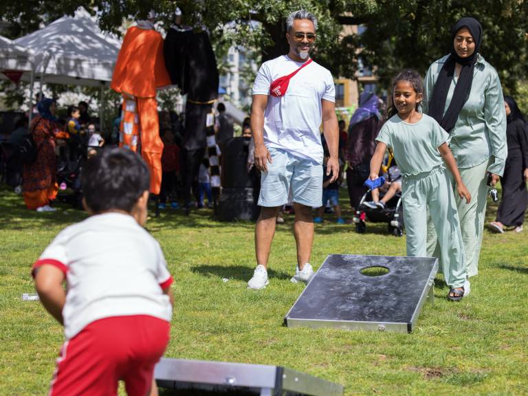 A family play park games together at the Summer of Wellbeing festival in Bartlett Park