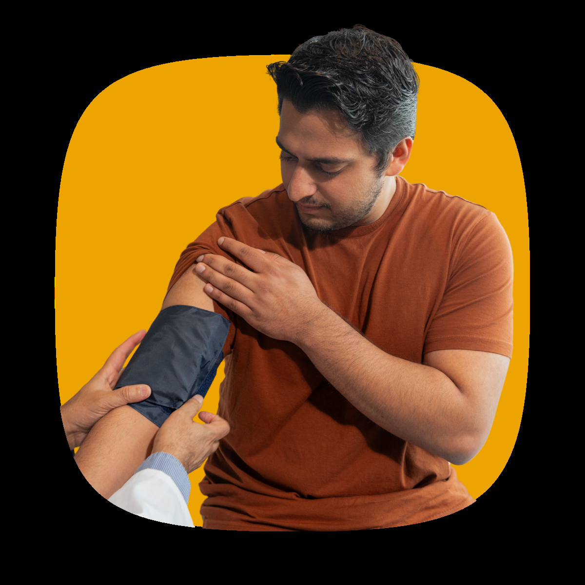 A doctor wraps a blood pressure cuff around a man's arm during a free blood pressure check at a local pharmacy