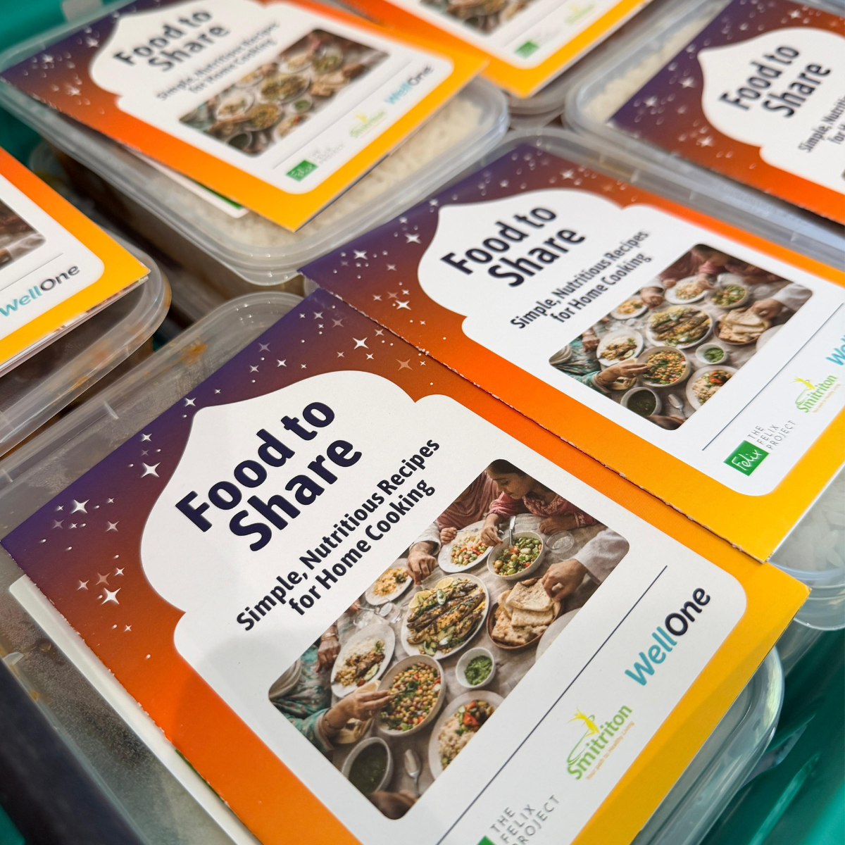 A crate of meals cooked at Felix Project kitchen, along with healthy eating 'Food to Share' leaflets