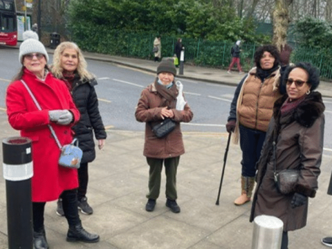 The walking group meet up outside in Isle of Dogs, ready to set off