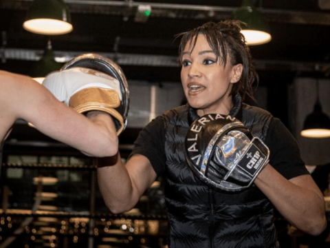 Boxing coach, Valerian Spencer, sparring with another woman