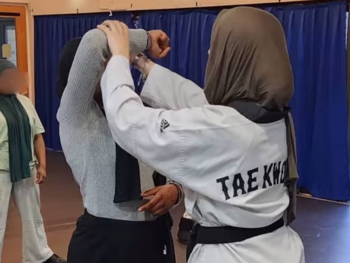 Two women are taking part in a self defense class at Poplar Union
