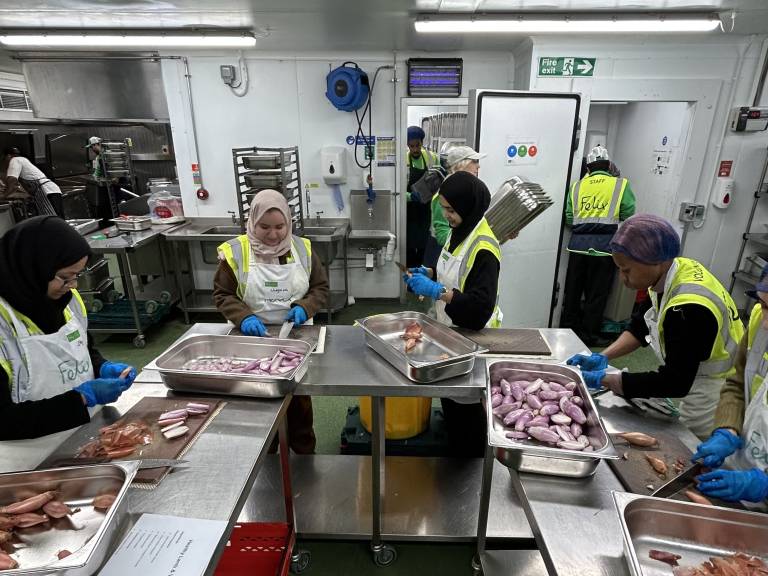 Volunteers and Felix Project staff are busy in the kitchen prepping ingredients, cooking and organising the kitchen equipment